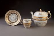 Bristol Teapot and Cover and Double-Ogee-Shaped Teacup and Saucer with Gilt Neoclassical Decora ...