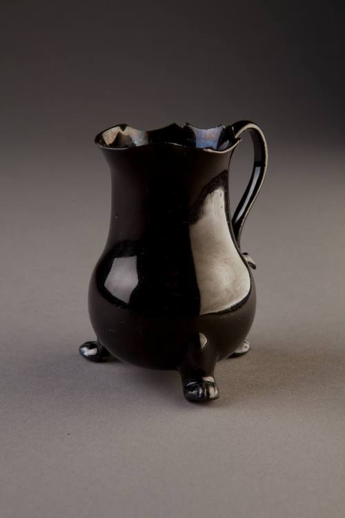 Staffordshire, Black-Glazed Brown Stoneware Milk Jug with Three Paw Feet, ca. 1765. Brown stone ...