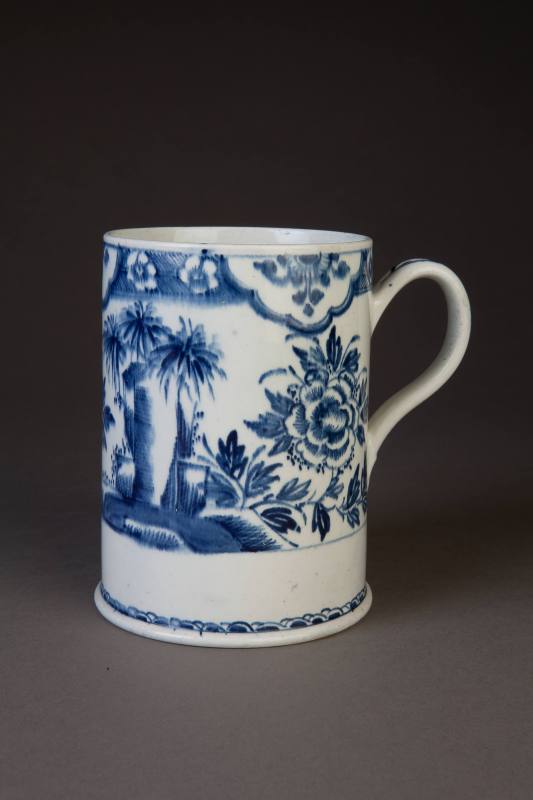 Bow Cylindrical Mug Painted in Underglaze Blue with Oriental Flowering Plants and Rockwork, ca. ...